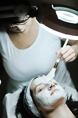 Image showing woman with facial mask in cosmetic studio