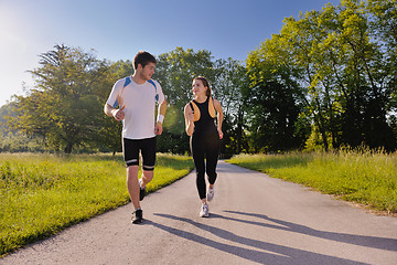 Image showing Young couple jogging