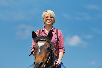 Image showing happy woman  on  horse