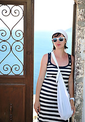 Image showing Greek woman on the streets of Oia, Santorini, Greece