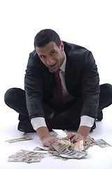 Image showing Business man holding money