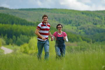 Image showing Portrait of romantic young couple smiling together outdoor