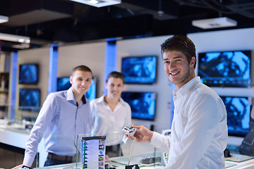 Image showing Young couple in consumer electronics store