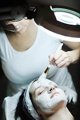 Image showing woman with facial mask in cosmetic studio