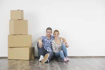 Image showing Young couple moving in new home