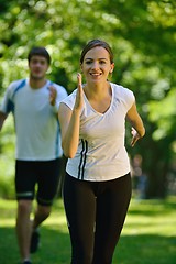 Image showing Young couple jogging