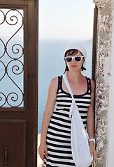 Image showing Greek woman on the streets of Oia, Santorini, Greece