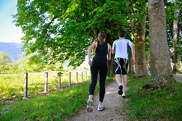 Image showing Young couple jogging