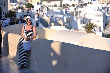 Image showing Greek woman on the streets of Oia, Santorini, Greece