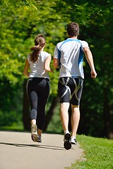 Image showing Young couple jogging