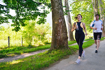 Image showing Young couple jogging