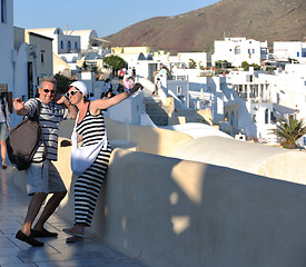 Image showing Greek woman on the streets of Oia, Santorini, Greece