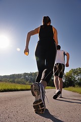 Image showing Young couple jogging