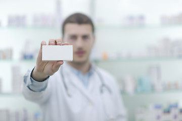 Image showing pharmacist chemist man in pharmacy drugstore