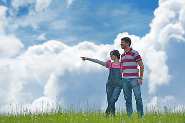 Image showing Portrait of romantic young couple smiling together outdoor