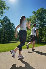 Image showing Young couple jogging at morning