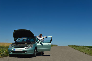 Image showing woman with broken car