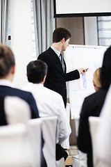 Image showing Young  business man giving a presentation on conference