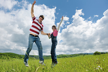 Image showing Portrait of romantic young couple smiling together outdoor