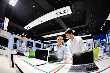 Image showing Young couple in consumer electronics store