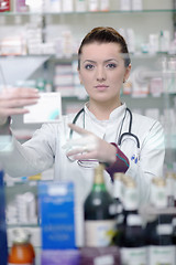 Image showing pharmacist chemist woman standing in pharmacy drugstore