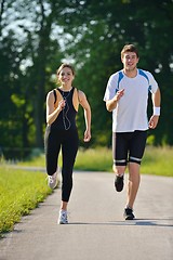 Image showing Young couple jogging at morning