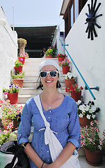 Image showing Greek woman on the streets of Oia, Santorini, Greece