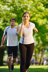 Image showing Young couple jogging