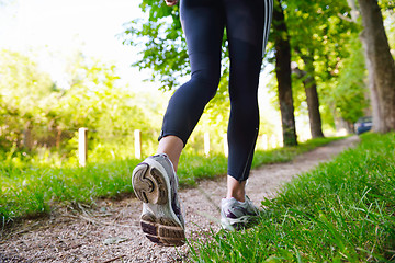 Image showing Young beautiful  woman jogging