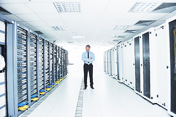 Image showing young it engeneer in datacenter server room