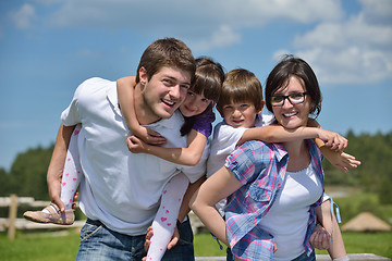 Image showing happy young family have fun outdoors