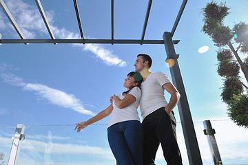 Image showing couple relaxing on balcony