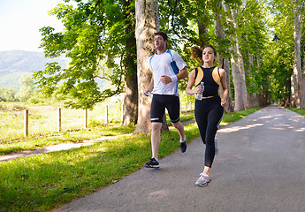 Image showing Young couple jogging