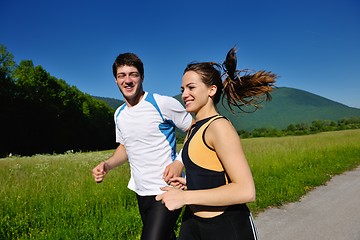 Image showing Young couple jogging