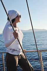 Image showing Greek woman on the streets of Oia, Santorini, Greece