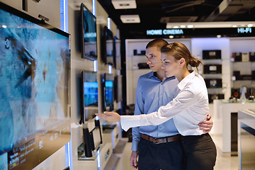 Image showing Young couple in consumer electronics store