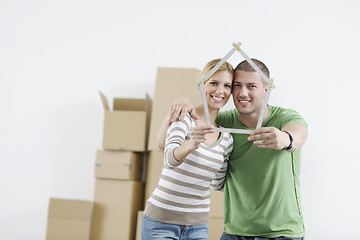 Image showing Young couple moving in new home