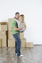 Image showing Young couple moving in new home