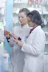 Image showing team of pharmacist chemist woman  in pharmacy drugstore