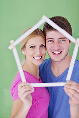 Image showing happy couple paint wall at new home