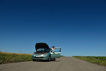 Image showing woman with broken car