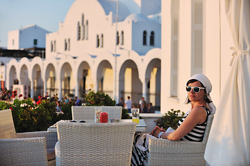 Image showing Greek woman on the streets of Oia, Santorini, Greece