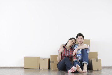 Image showing Young couple moving in new home