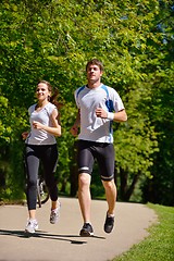 Image showing Young couple jogging