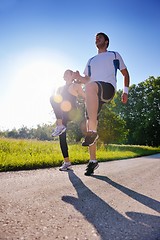 Image showing Young couple jogging