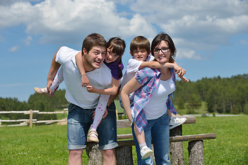 Image showing happy young family have fun outdoors