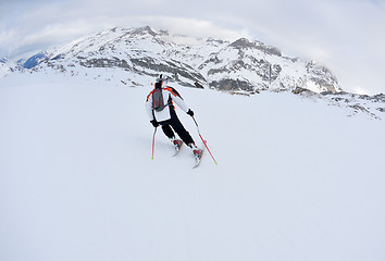 Image showing skiing on fresh snow at winter season at beautiful sunny day