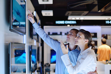 Image showing Young couple in consumer electronics store