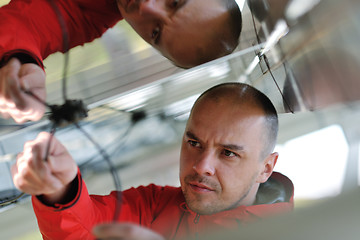 Image showing Male solar panel engineer at work place