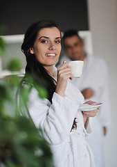 Image showing Young love couple taking fresh morning cup of coffee